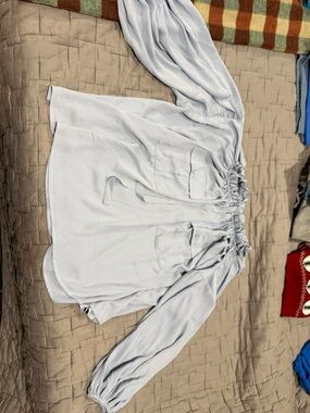 Off-Shoulder Light Blue Blouse with Front Pockets